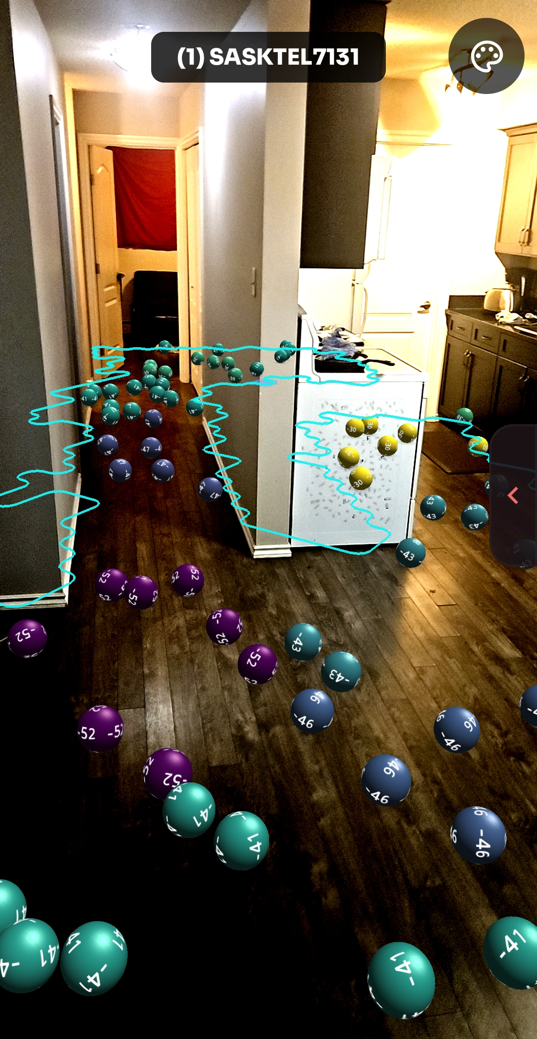 NetLens Schnellscan Bälle-Modus - dBm-beschriftete Kugeln, nach WLAN-Signalstärke gefärbt, die in Augmented Reality über den Boden eines Raums hüpfen